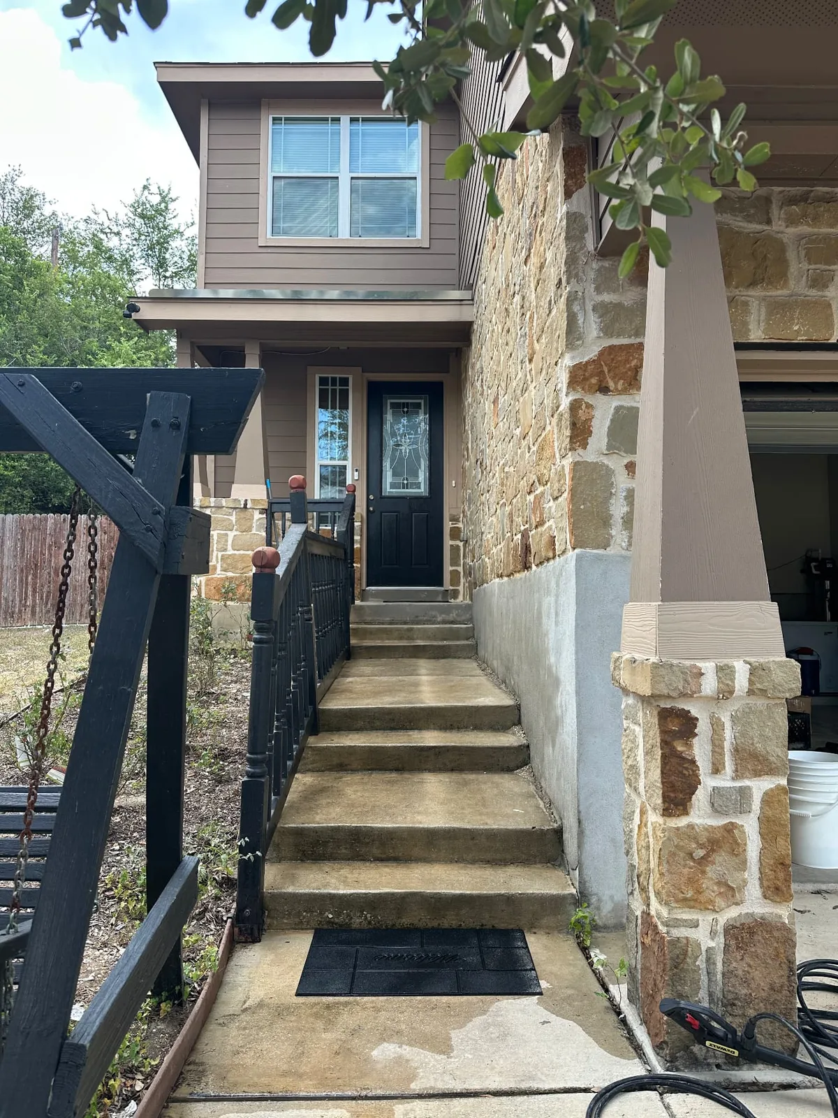 Front entry steps and walkway with dirt, algae staining, and buildup before pressure washing.